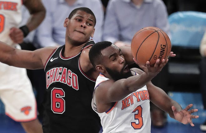 New York Knicks forward Tim Hardaway Jr. (3) puts up a shot against Chicago Bulls center Cristiano Felicio (6) during the third quarter, Monday, March 19, 2018, in New York. The Bulls won 110-92. [JULIE JACOBSON/THE ASSOCIATED PRESS]