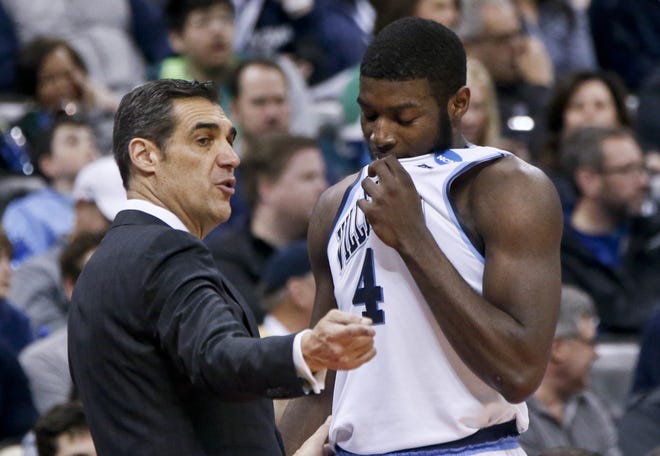 Villanova head coach Jay Wright, left, talks with Eric Paschall during the second half of a second-round game in the NCAA men's college basketball tournament against Alabama, Saturday, March 17, 2018, in Pittsburgh. Villanova won 81-58. (AP Photo/Keith Srakocic)