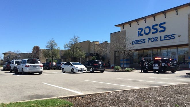Several Round Rock police vehicles blocked a section of the University Oaks Shopping Center parking lot in front of Ross Dress for Less Tuesday afternoon. Photo by Mike Parker
