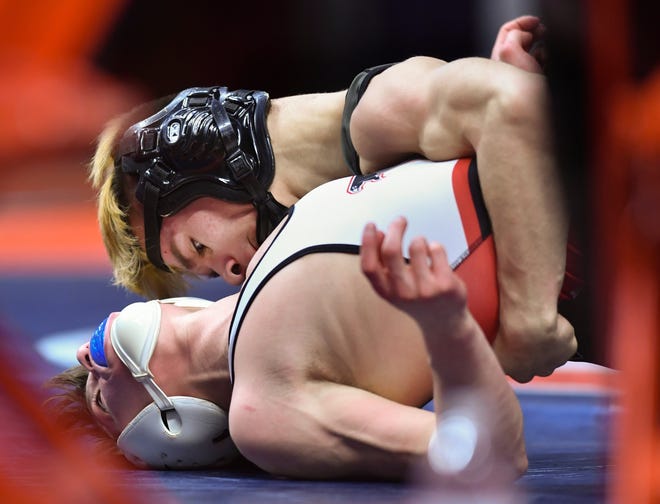 RON JOHNSON/JOURNAL STAR Monte Gregory of El Paso-Gridley pins opponent Cale Horsch of Gibson City-Melvin-Sibley during their 106 Class 1A title match during the IHSA State Wrestling Tournament at Champaign on Saturday.