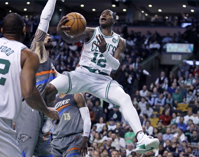 Celtics guard Terry Rozier drives to the basket during Boston's 100-99 comeback win over the Thunder on Tuesday night at TD Garden.
