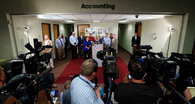 Gov. Mary Fallin and others address local and international media convering the 2013 Moore tornado. [Photo by Steve Sisney, The Oklahoman Archives]