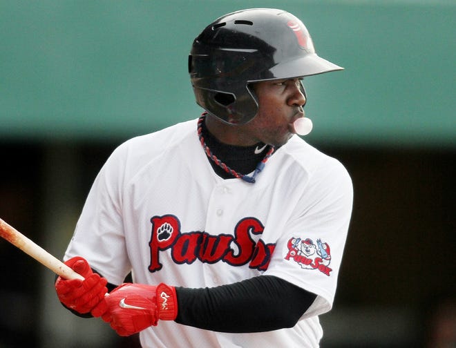 PawSox Rusney Castillo blows a bubble while waiting for a pitch during a game last season.
