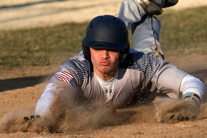 Monmouth-Roseville's JC Sells slides into home plate on Wednesday afternoon during an 11-1 win over Sherrard.  STEVE DAVIS/REVIEW ATLAS