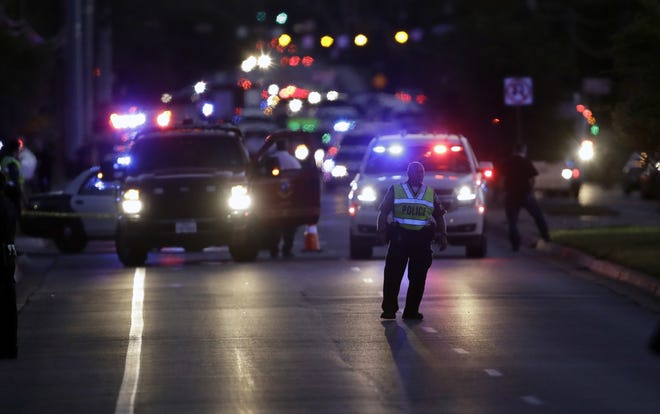 Emergency vehicles stage near the site of another explosion, Tuesday, March 20, 2018, in Austin, Texas. (AP Photo/Eric Gay)