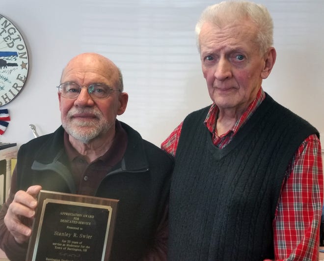 Joel Sherburne, chair of Barrington Do-Gooders, right, presents an award of appreciation to Stanley Swier, retiring Town Moderator of Barrington. [Ron Cole/Fosters.com]