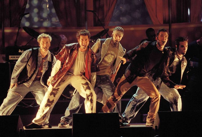 Members of 'N Sync, from left, Lance Bass, Joey Fatone, Justin Timberlake, JC Chasez and Chris Kirkpartrick perform in 2000. The boy band will earn a star on the Hollywood Walk of Fame on April 30. [AP Photo / Chris Pizzello, File]
