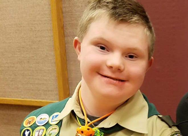 Logan Blythe, 15, poses for a photo in his Boy Scout uniform. MUST CREDIT: Chad Blythe