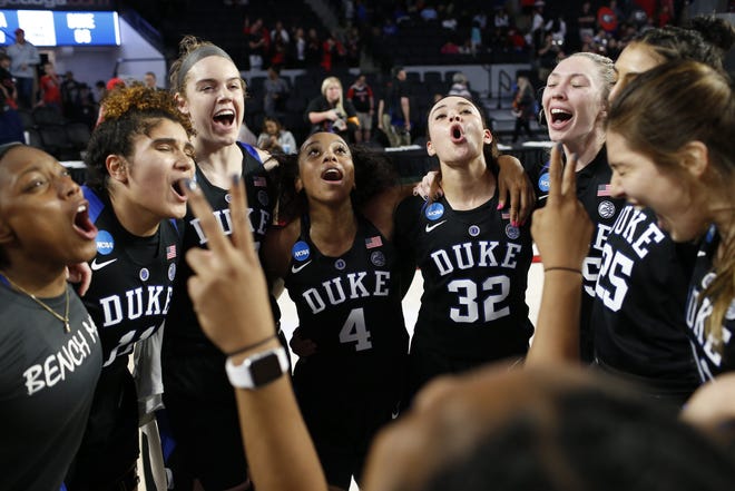 Duke players celebrate after getting a second-round win over Georgia in the NCAA Tournament on Monday. [JOSHUA L. JONES/THE ASSOCIATED PRESS]