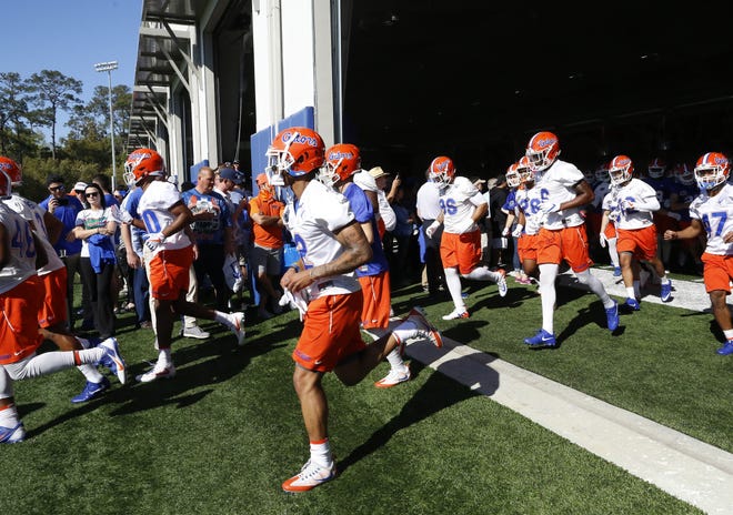 The Florida Gators take the field during spring practice at the Sanders Practice Fields on the UF campus. [Brad McClenny/Staff photographer]