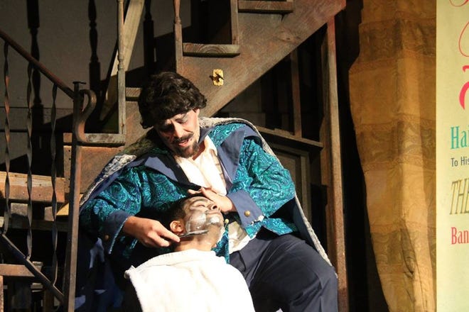 Adolfo Perelli, played by Tony Agati, shaves a customer in "Sweeney Todd, Demon Barber of Fleet Street" at the Bay Street Players in Eustis this weekend. [SUBMITTED]