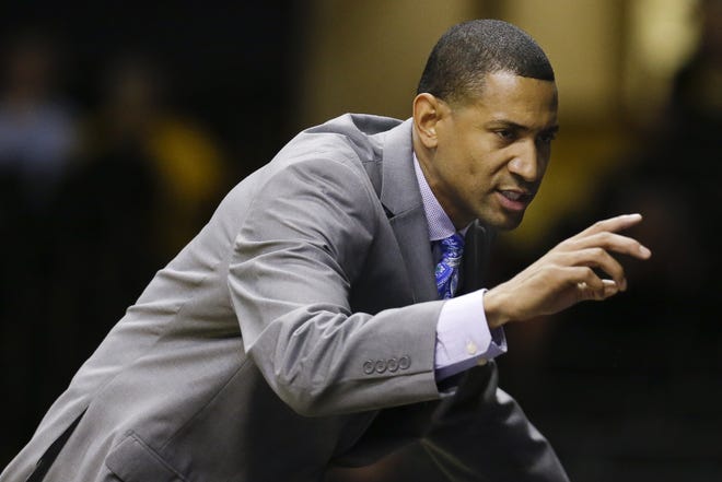 Tennessee State coach Dana Ford talks to his players in the first half of a game against Vanderbilt on Nov. 23, 2014, in Nashville, Tenn. (AP Photo/Mark Humphrey)