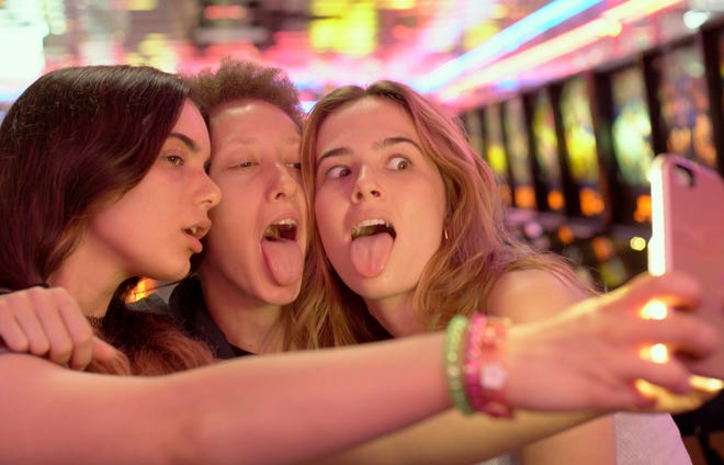 Three teenage girls (played by, from left, Dylan Gelula, Maya Eshet and Zoey Deutch) conspire to exact revenge on an accused pedophile in “Flower.” [The Orchard]