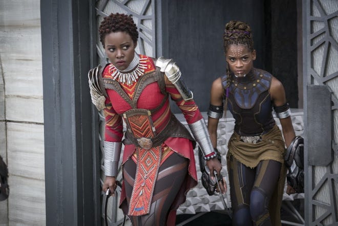 Lupita Nyong'o, left, and Letitia Wright in a scene from Marvel Studios' "Black Panther." [MARVEL STUDIOS-DISNEY VIA AP]