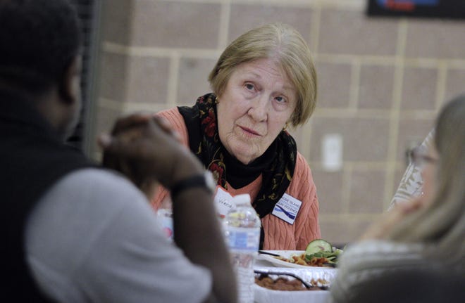 Wendy Van Orden, of Woonsocket, listens to one of her tablemates at the Together RI community conversation. [The Providence Journal / Kris Craig]