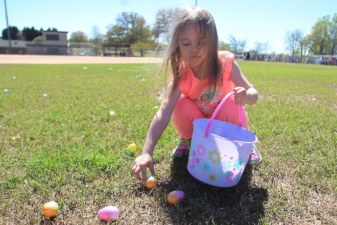 Elisabeth Terry collects Easter eggs at last year's event. [Star file photo]