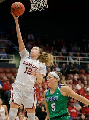 Stanford guard Brittany McPhee (12) shoots over Florida Gulf Coast guard Lisa Zderadicka (5) during the second half of a second-round game in the NCAA women's college basketball tournament in Stanford, Calif., Monday, March 19, 2018. (AP Photo/Jeff Chiu)