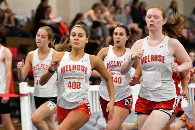 Melrose track star Kiera Sixsmith, far right, runs alongside teammates (from far left) Grace Mercer, Sarah Herron and Jenna Thorpe, competing in the 600m race during their meet at the Reggie Lewis Center in Roxbury, Dec. 29, 2016. [Wicked Local Staff Photo / David Sokol]