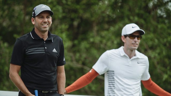 Sergio Garcia of Spain and Dylan Frittelli of South Africa share a funny moment on the 12th tee box during the second round of the WGC - Dell Technologies Match Play golf tournament at Austin Country Club.