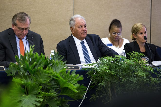 Mori Hosseini, center, was elected chairman of the University of Florida's board of trustees Friday. It's the third such position the Ormond Beach homebuilder has held, having also chaired the trustees at Embry-Riddle, his alma mater, and the State University System's Board of Governors. [Lauren Bacho/Gainesville Sun]