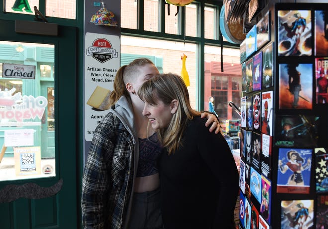 Off The Wagon owner Michelle Sahr discusses local and independent toy stores. Sahr's daughter, Meghan, gives her mother a hug before leaving the store. Lisa Scalfaro, Record-Courier