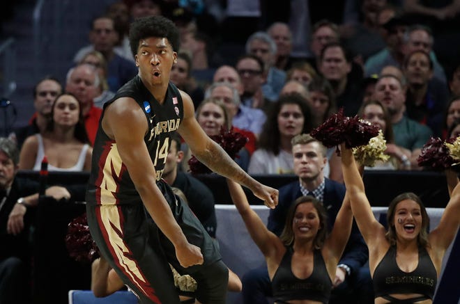 Florida State guard Terance Mann (14) celebrates after scoring against Gonzaga during the second half of an NCAA men's college basketball tournament regional semifinal Thursday, March 22, 2018, in Los Angeles. (AP Photo/Jae Hong)