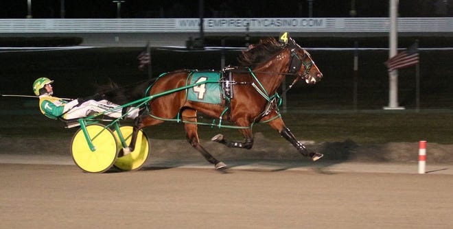 Shartin N, with Tim Tetrick driving, captures the second division of the Blue Chip Matchmaker from the fourth pole position at Yonkers Raceway on Friday, March 23. (Darragh Riordan, for Monticello Raceway)