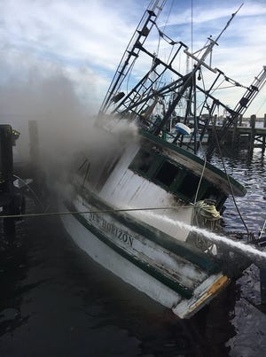 Scene of commercial fishing boat fire. [PENSACOLA FIRE DEPARTMENT]