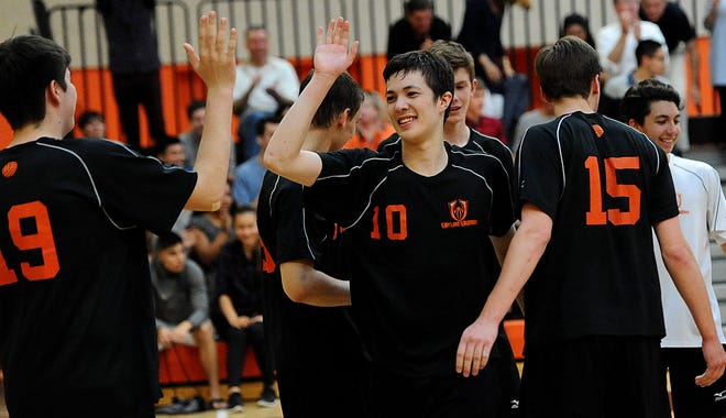Despite the loss of longtime coach Rod Fletcher from last year's team that reached the Div. 1 state final, senior Oliver Moody (10) and the Wayland boys volleyball expect to still have a strong team under former assistant coach Phil George.
