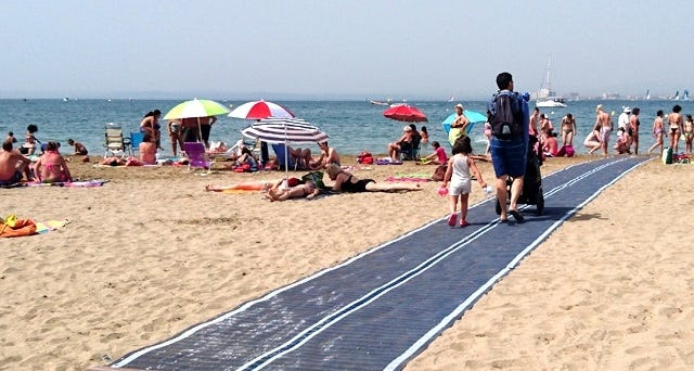 A mat similar to the one pictured here has been installed at Navarre Beach to make access to the beach easier for people with mobility problems, as well as people with strollers. [COURTESY PHOTO/DESCHAMPS SAS & DESCHAMPS MAT SYSTEMS]