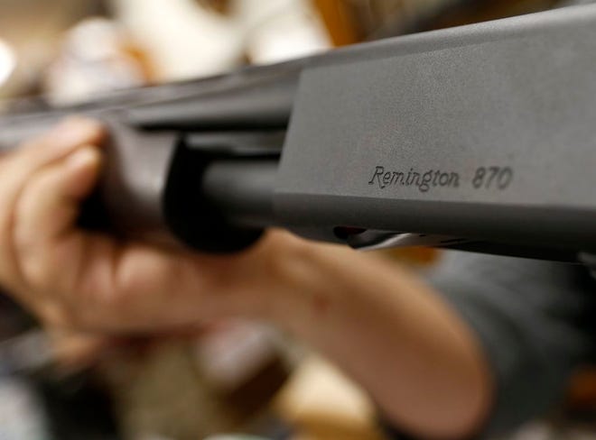 . U.S. gun maker Remington Outdoor Company filed for bankruptcy protection, after years of falling sales and lawsuits tied to the Sandy Hook Elementary School massacre. Records from the bankruptcy court of the district of Delaware show that the company filed late Sunday, March 25. (AP Photo/Keith Srakocic, File)