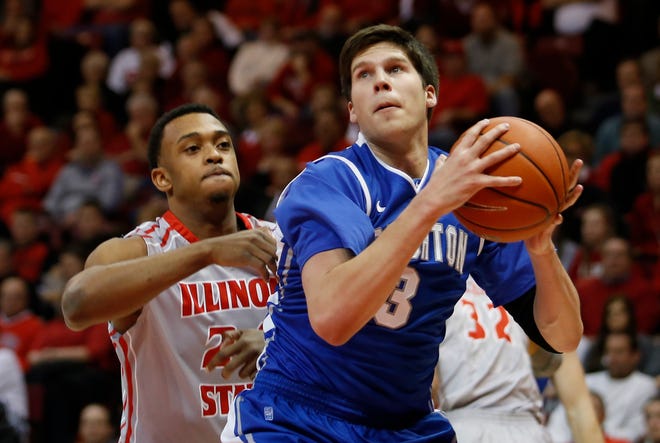 FILE - In this Jan. 2, 2013, file photo, Creighton's Doug McDermott (3) looks for room to shoot past Illinois State's Zeke Upshaw (24) during the first half of an NCAA college basketball game at Redbird Arena in Normal, Ill. Upshaw, the Detroit Pistons developmental player who collapsed on the court during a NBA G League game in Michigan has died. The Grand Rapids Drive says 26-year-old Upshaw died at a hospital Monday, March 26, 2018. No cause was disclosed. (AP Photo/ Stephen Haas, File)