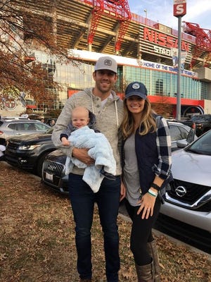 Pictured is Alex Tanney and his wife Rebecca with their son Gunner.