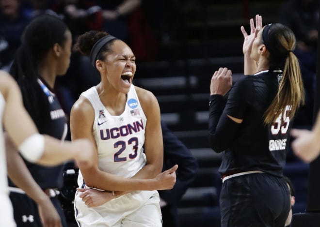 Connecticut's Azura Stevens (23) celebrates after scoring during the first half of the Huskies' 94-65 win over South Carolina on Monday night in Albany, N.Y., to reach the Final Four.