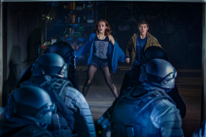 Samantha (Olivia Cooke) and Wade (Tye Sheridan) are caught off-guard by their foes. [Warner Bros. Pictures]