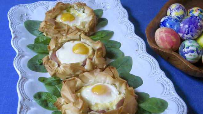Eggs baked in pastry nests made of phyllo are from a recipe by Sara Moulton. (Sara Moulton via AP)