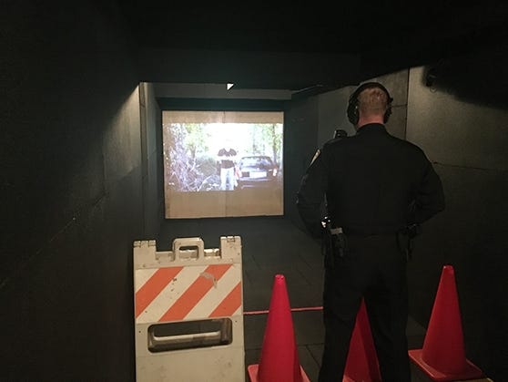 A member of the Acton Police Department participates in training on the Middlesex Sheriff’s Office Mobile Training Center on March 6 in Acton. [Courtesy Photo]