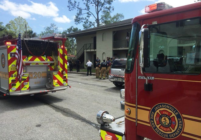 Jacksonville firefighters at the scene Wednesday of a fire at the Avesta Grande Pointe apartment complex at 5800 University Blvd. W. One woman was found dead inside an apartment, according to fire officials. [First Coast News]
