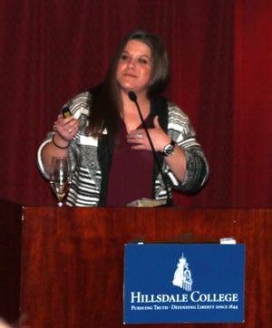 Young Life Area Director Katie Jason makes a keynote address during a fundraising baquet at Hillsdale College. [NANCY HASTINGS PHOTO]