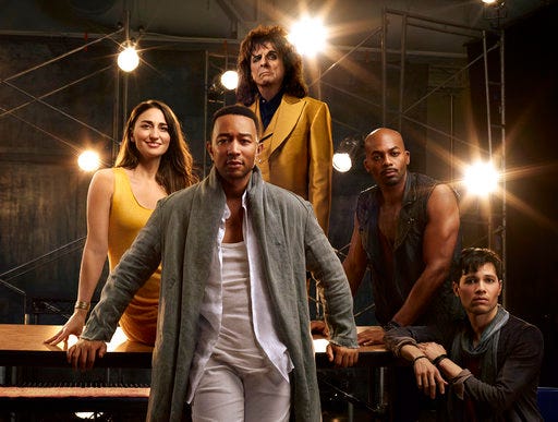 This image released by NBC shows, clockwise from foreground center, John Legend as Jesus Christ, Sara Bareilles as Mary Magdalene, Alice Cooper as King Herod, Brandon Victor Dixon as Judas Iscariot and Jason Tam as Peter from the NBC production, "Jesus Christ Superstar Live In Concert," airing April 1. (James Dimmock/NBC via AP)