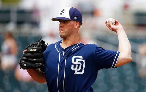 San Diego Padres starting pitcher Clayton Richard throws a pitch against the Cincinnati Reds during the first inning of a spring training baseball game Saturday, March 24, 2018, in Goodyear, Ariz. (AP Photo/Ross D. Franklin)