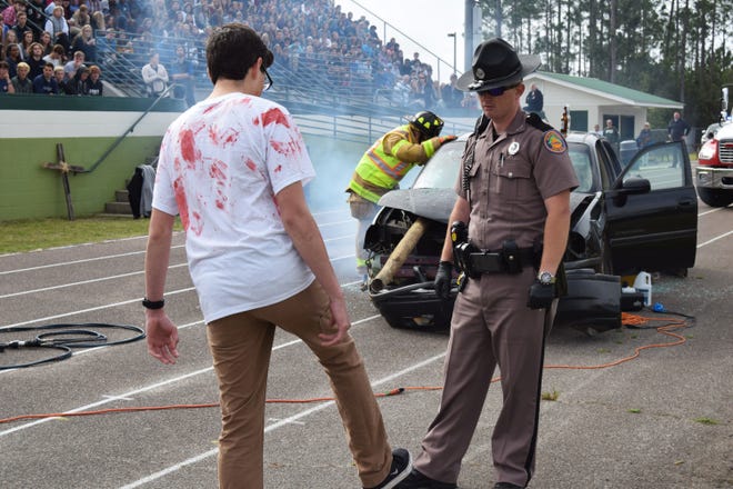 First responders and students demonstrate the devastation of a DUI crash in front of the student body at South Walton High School in preparation of prom season. [CONTRIBUTED PHOTOS]