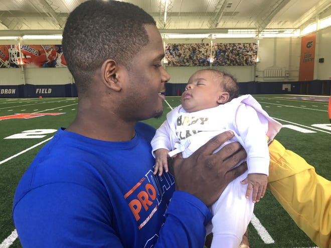 Florida receiver Antonio Callaway holds his daughter, Aulani, during Pro Day on Wednesday in Gainesville. [Phillip Heilman/GateHouse Florida]
