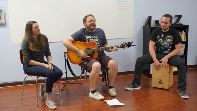 Matt Greene, center, plays originals for the weekly News Herald Jam Session on March 23, accompanied by his wife, Janelle, and beatbox player Tyler Jones. [PHOTOS BY KRISTY SMITH/THE NEWS HERALD]