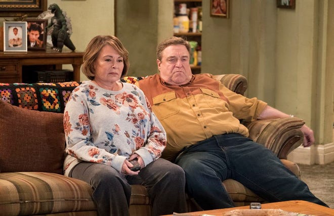 In this image released by ABC, Roseanne Barr, left, and John Goodman appear in a scene from the reboot of "Roseanne." (Adam Rose/ABC via AP, File)