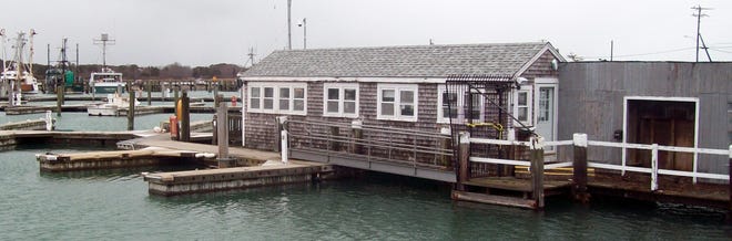 The old harbormaster office at the Sandwich Marina has been hit hard by winter storms, and it may be removed toward the end of this year.



Photo by Paul Gately
