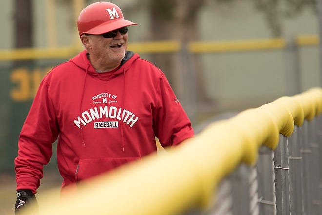 Monmouth College assistant coach Ron Nelson enjoys a laugh during a game with Knox on Wednesday. The Fighting Scots won the first game 4-1 and led the second game 10-9 after eight innings before it was called due to darkness.  STEVE DAVIS/REVIEW ATLAS