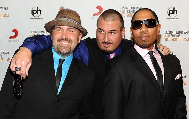 Color Me Badd's Mark Calderon, left, Bryan Abrams and Kevin Thornton are shown during a 2011 event in Las Vegas, Nevada. Calderon and Abrams will perform during Friday's 90s Flashback Tour at Erie's Warner Theatre. [THE ASSOCIATED PRESS]