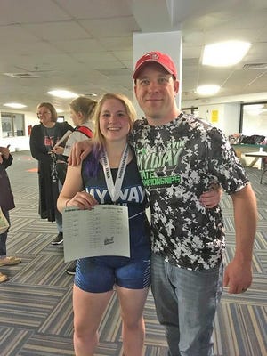 Union City senior Angelica (AJ) Iobe is all smiles as she poses with UCHS wrestling coach Randy Windener after earning her MYWAY State Championship