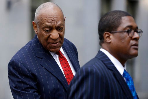 Bill Cosby, left, arrives for a pretrial hearing in his sexual assault case, Friday, March 30, 2018, at the Montgomery County Courthouse in Norristown, Pa. (AP Photo/Matt Slocum)